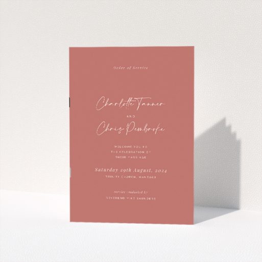 Elegant A5 wedding order of service booklet with muted terracotta backdrop, featuring graceful script font for couple's names, ideal for modern couples seeking refined simplicity This is a view of the front