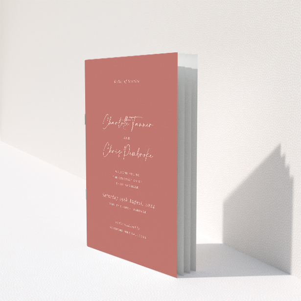 Elegant A5 wedding order of service booklet with muted terracotta backdrop, featuring graceful script font for couple's names, ideal for modern couples seeking refined simplicity This image shows the front and back sides together
