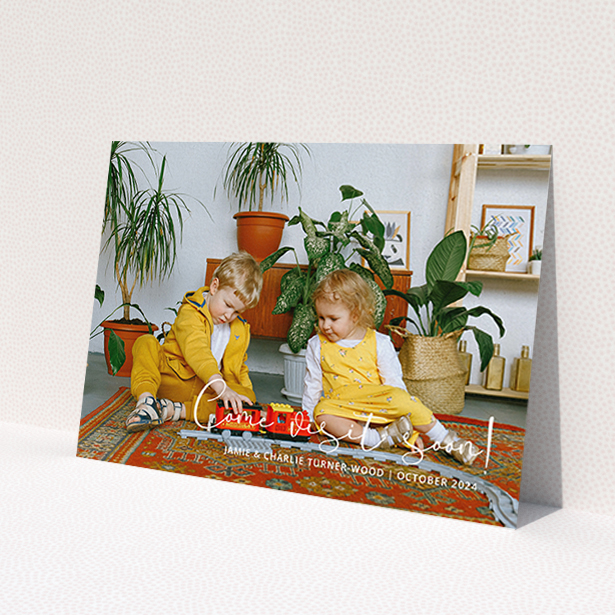 A change of address card called 'Come Visit Soon'. It is an A6 card in a landscape orientation. It is a photographic change of address card with room for 1 photo. 'Come Visit Soon' is available as a flat card, with mainly white colouring.