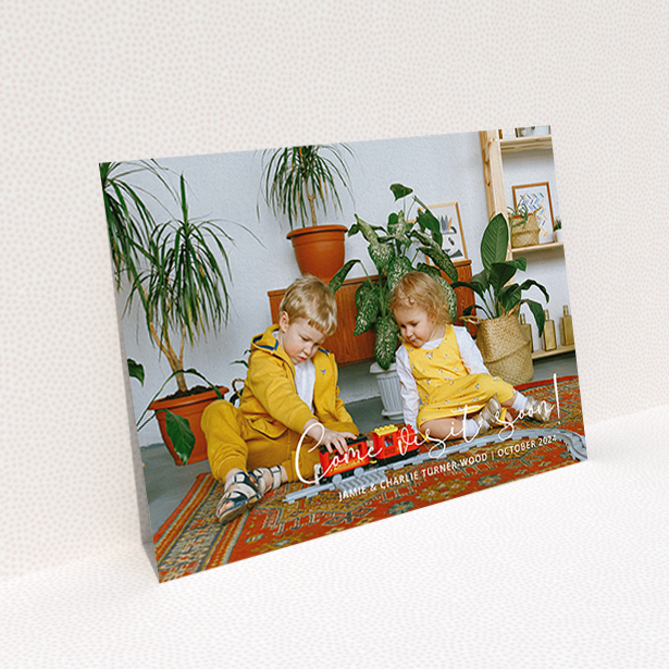 A change of address card called "Come Visit Soon". It is an A6 card in a landscape orientation. It is a photographic change of address card with room for 1 photo. "Come Visit Soon" is available as a flat card, with mainly white colouring.
