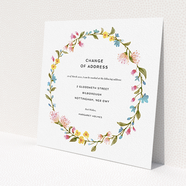 A change of address card named "Spring Wreath". It is a square (148mm x 148mm) card in a square orientation. "Spring Wreath" is available as a flat card, with mainly pink colouring.