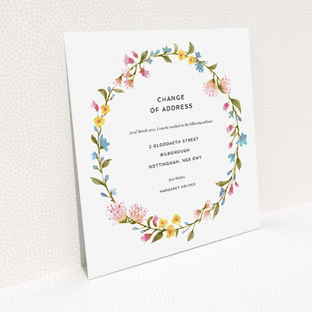A change of address card named "Spring Wreath". It is a square (148mm x 148mm) card in a square orientation. "Spring Wreath" is available as a flat card, with mainly pink colouring.