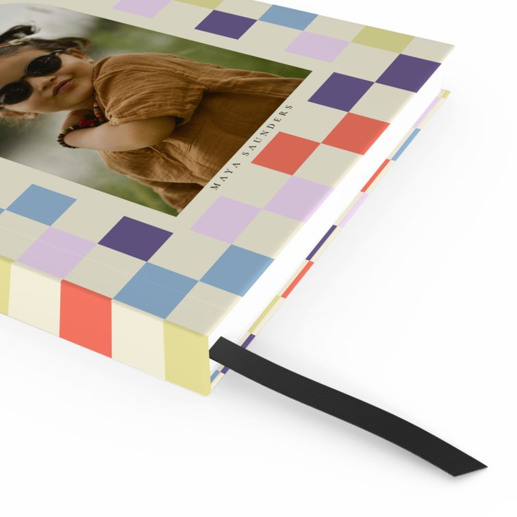 Colourful checkered design for personalised notebooks with one photo placeholder.