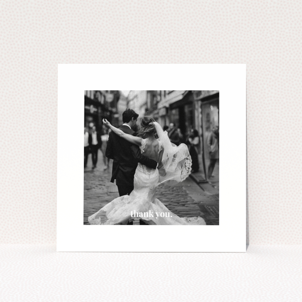 Wedding thank you card with one photo of a newlywed couple dancing.