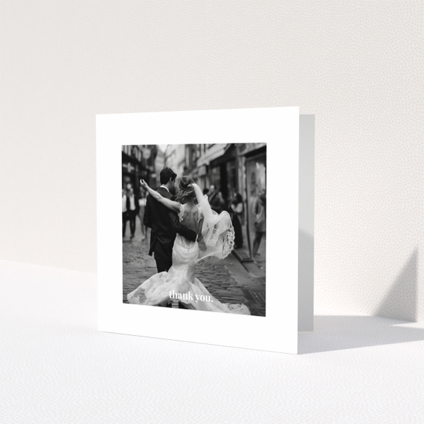 Wedding thank you card with one photo of a newlywed couple dancing.