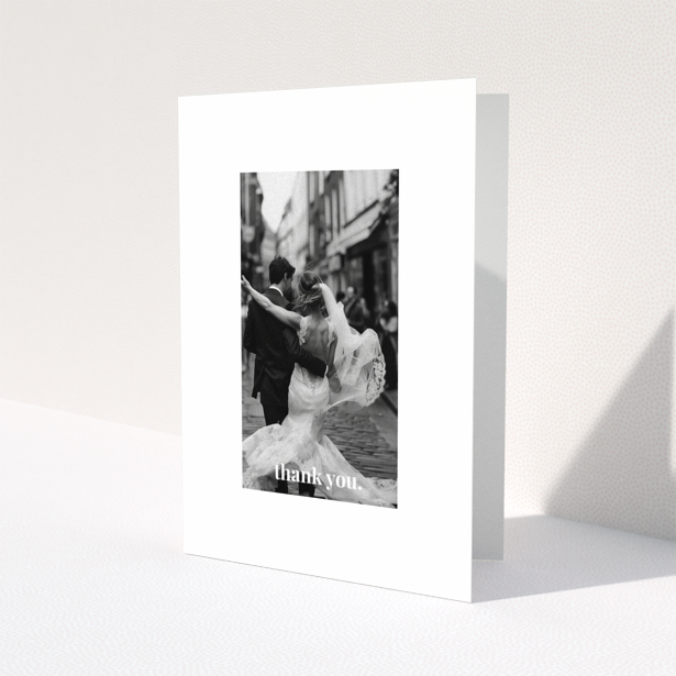 Wedding thank you card with one photo of a newlywed couple dancing.