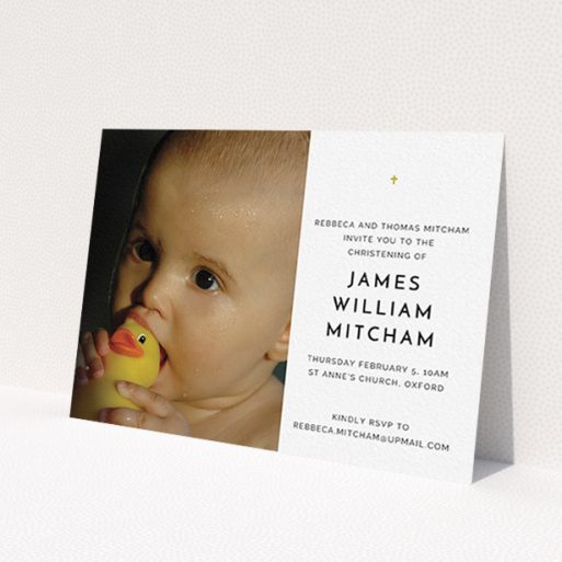 A christening invitation design named 'Baby Cross'. It is an A6 invite in a landscape orientation. It is a photographic christening invitation with room for 1 photo. 'Baby Cross' is available as a flat invite, with tones of white and gold.