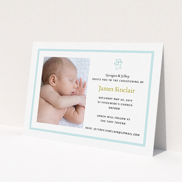 A christening invitation named 'Blue Teddy'. It is an A6 invite in a landscape orientation. It is a photographic christening invitation with room for 1 photo. 'Blue Teddy' is available as a flat invite, with tones of blue and white.