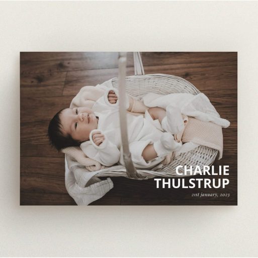 Christening Invitation Design - "Bold Corner Photo" A christening invitation named "Bold Corner Photo". It is an A5 invite in a landscape orientation. It is a photographic christening invitation with room for 1 photo. "Bold Corner Photo" is available as a flat invite, with mainly white colouring.
