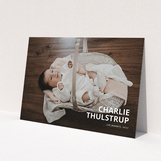 A christening invitation named 'Bold Corner Photo'. It is an A5 invite in a landscape orientation. It is a photographic christening invitation with room for 1 photo. 'Bold Corner Photo' is available as a flat invite, with mainly white colouring.
