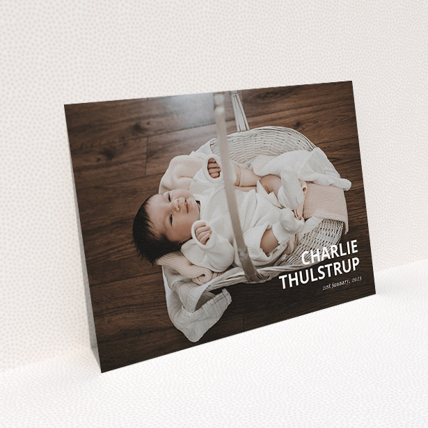 A christening invitation named "Bold Corner Photo". It is an A5 invite in a landscape orientation. It is a photographic christening invitation with room for 1 photo. "Bold Corner Photo" is available as a flat invite, with mainly white colouring.