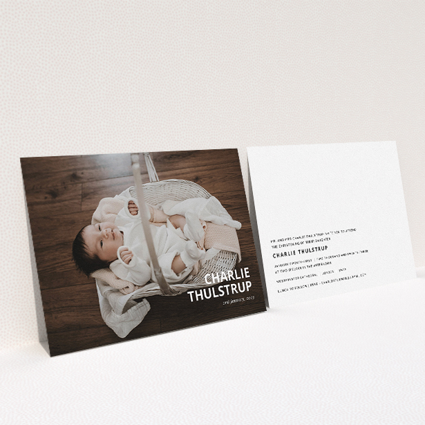 A christening invitation named "Bold Corner Photo". It is an A5 invite in a landscape orientation. It is a photographic christening invitation with room for 1 photo. "Bold Corner Photo" is available as a flat invite, with mainly white colouring.
