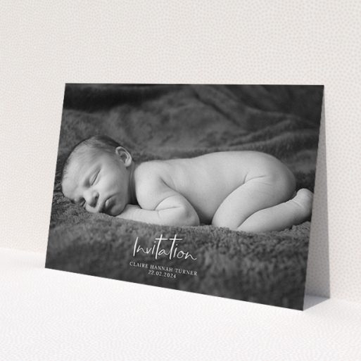 A christening invitation template titled 'Central Script'. It is an A5 invite in a landscape orientation. It is a photographic christening invitation with room for 1 photo. 'Central Script' is available as a flat invite, with mainly white colouring.