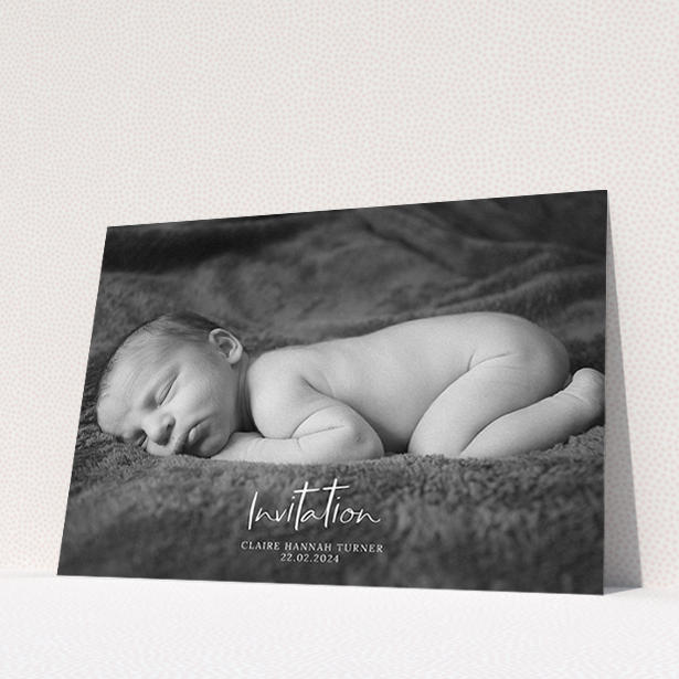 A christening invitation template titled "Central Script". It is an A5 invite in a landscape orientation. It is a photographic christening invitation with room for 1 photo. "Central Script" is available as a flat invite, with mainly white colouring.