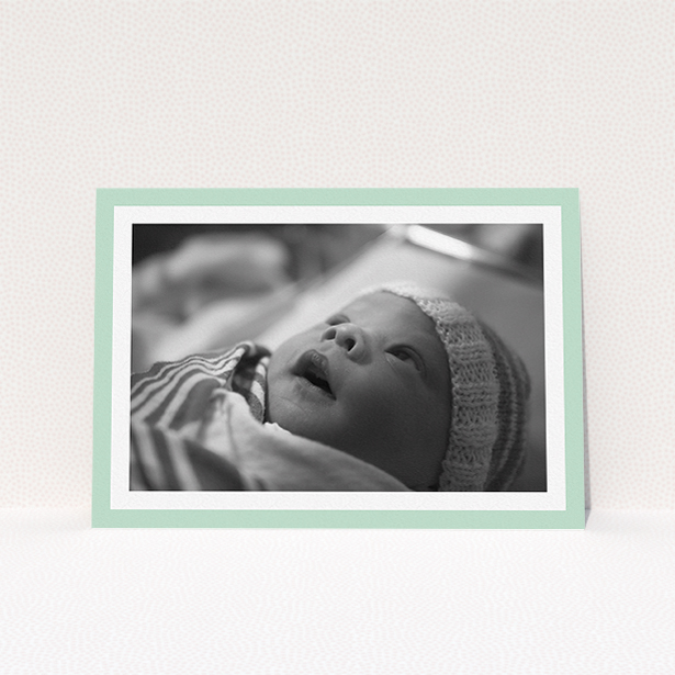 A christening invitation design titled "Classic Mint Photo Frame". It is an A5 invite in a landscape orientation. It is a photographic christening invitation with room for 1 photo. "Classic Mint Photo Frame" is available as a flat invite, with tones of green and white.