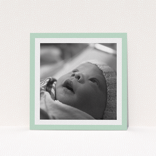 A christening invitation called "Classic Mint Photo Frame". It is a square (148mm x 148mm) invite in a square orientation. It is a photographic christening invitation with room for 1 photo. "Classic Mint Photo Frame" is available as a flat invite, with tones of green and white.