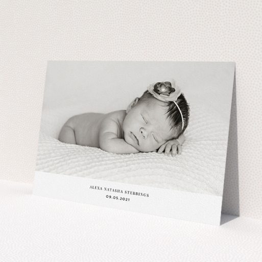 A christening invitation named 'Duke of York Square'. It is an A5 invite in a landscape orientation. It is a photographic christening invitation with room for 1 photo. 'Duke of York Square' is available as a flat invite, with mainly white colouring.