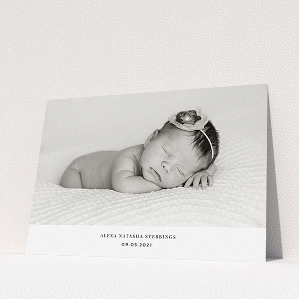 A christening invitation named "Duke of York Square". It is an A5 invite in a landscape orientation. It is a photographic christening invitation with room for 1 photo. "Duke of York Square" is available as a flat invite, with mainly white colouring.