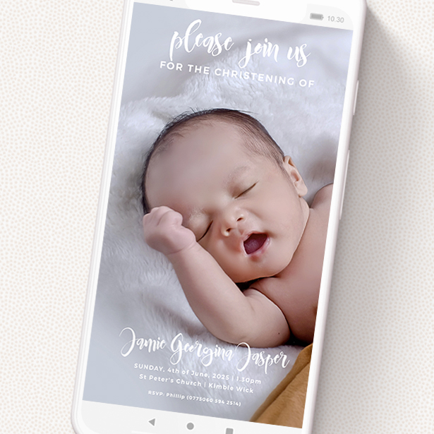A christening invitation for whatsapp design called 'On the Photo'. It is a smartphone screen sized invite in a portrait orientation. It is a photographic christening invitation for whatsapp with room for 2 photos. 'On the Photo' is available as a flat invite, with mainly white colouring.