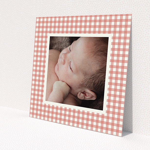 A christening invitation named "Pink Plaid". It is a square (148mm x 148mm) invite in a square orientation. It is a photographic christening invitation with room for 1 photo. "Pink Plaid" is available as a flat invite, with tones of pink and white.