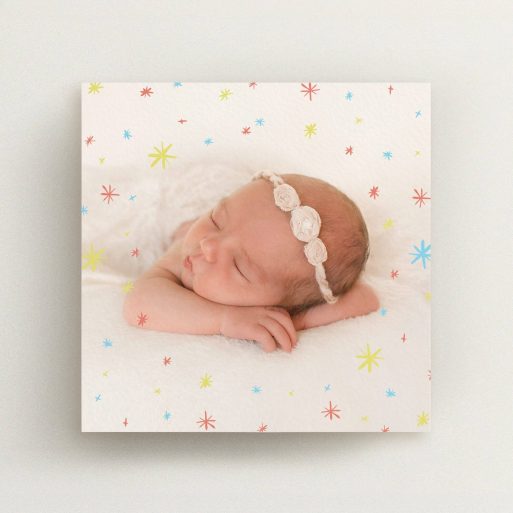 Christening Invitation Design - "Playground Stars" A christening invitation design named "Playground Stars". It is a square (148mm x 148mm) invite in a square orientation. It is a photographic christening invitation with room for 1 photo. "Playground Stars" is available as a flat invite, with mainly red colouring.