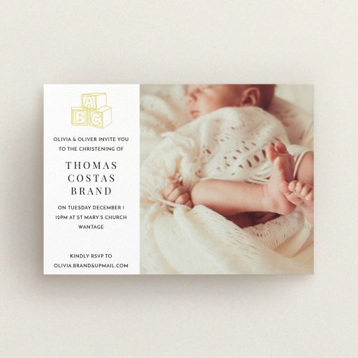 Christening Invitation Design - "Playtime" A christening invitation named "Playtime". It is an A6 invite in a landscape orientation. It is a photographic christening invitation with room for 1 photo. "Playtime" is available as a flat invite, with tones of white and yellow.