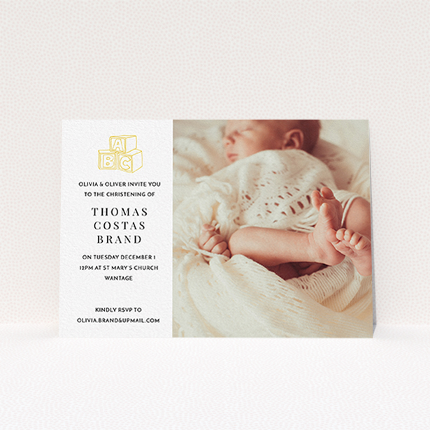 A christening invitation named "Playtime". It is an A6 invite in a landscape orientation. It is a photographic christening invitation with room for 1 photo. "Playtime" is available as a flat invite, with tones of white and yellow.