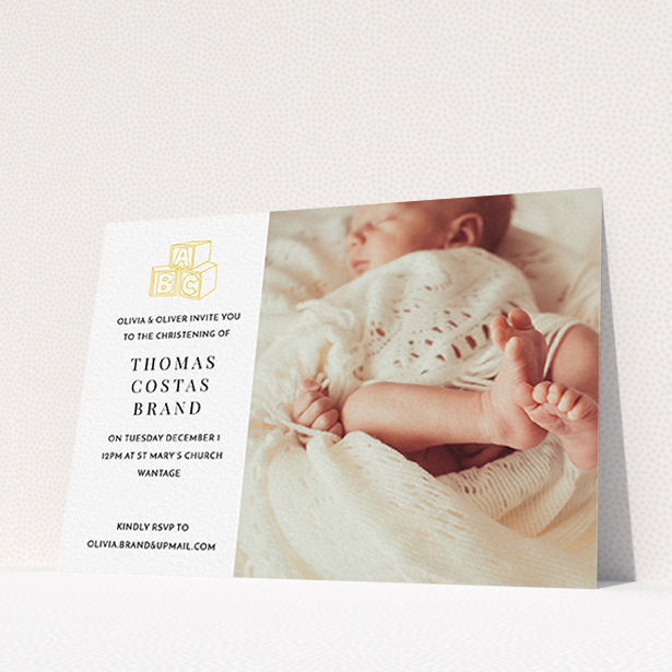 A christening invitation named "Playtime". It is an A6 invite in a landscape orientation. It is a photographic christening invitation with room for 1 photo. "Playtime" is available as a flat invite, with tones of white and yellow.