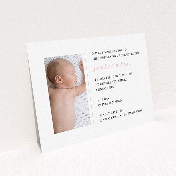 A christening invitation design titled "Please Welcome". It is an A6 invite in a landscape orientation. It is a photographic christening invitation with room for 1 photo. "Please Welcome" is available as a flat invite, with tones of white and pink.