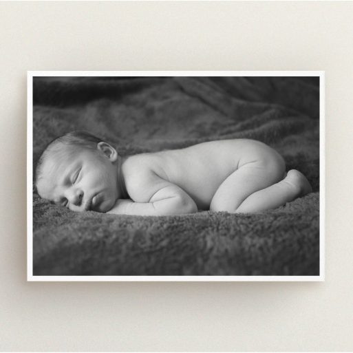Christening Invitation Design - "Thick White Framed Photo" A christening invitation named "Thick White Framed Photo". It is an A5 invite in a landscape orientation. It is a photographic christening invitation with room for 1 photo. "Thick White Framed Photo" is available as a flat invite, with mainly white colouring.