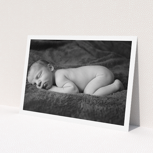 A christening invitation named 'Thick White Framed Photo'. It is an A5 invite in a landscape orientation. It is a photographic christening invitation with room for 1 photo. 'Thick White Framed Photo' is available as a flat invite, with mainly white colouring.