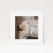 A christening invitation named "We have some news". It is a square (148mm x 148mm) invite in a square orientation. It is a photographic christening invitation with room for 1 photo. "We have some news" is available as a flat invite, with mainly white colouring.