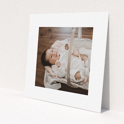 A christening invitation named 'We have some news'. It is a square (148mm x 148mm) invite in a square orientation. It is a photographic christening invitation with room for 1 photo. 'We have some news' is available as a flat invite, with mainly white colouring.