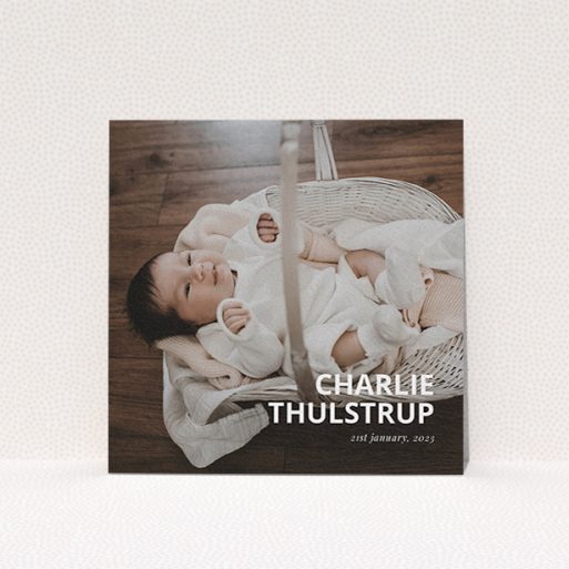 A christening invite design named "Bold Corner Photo". It is a square (148mm x 148mm) invite in a square orientation. It is a photographic christening invite with room for 1 photo. "Bold Corner Photo" is available as a flat invite, with mainly white colouring.