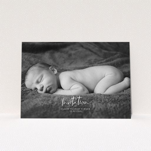 A christening invite design named "Central Script". It is an A6 invite in a landscape orientation. It is a photographic christening invite with room for 1 photo. "Central Script" is available as a flat invite, with mainly white colouring.