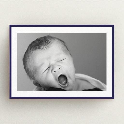 Christening Invite Design - "Classic Navy Photo Frame" A christening invite called "Classic Navy Photo Frame". It is an A5 invite in a landscape orientation. It is a photographic christening invite with room for 1 photo. "Classic Navy Photo Frame" is available as a flat invite, with tones of blue and white.