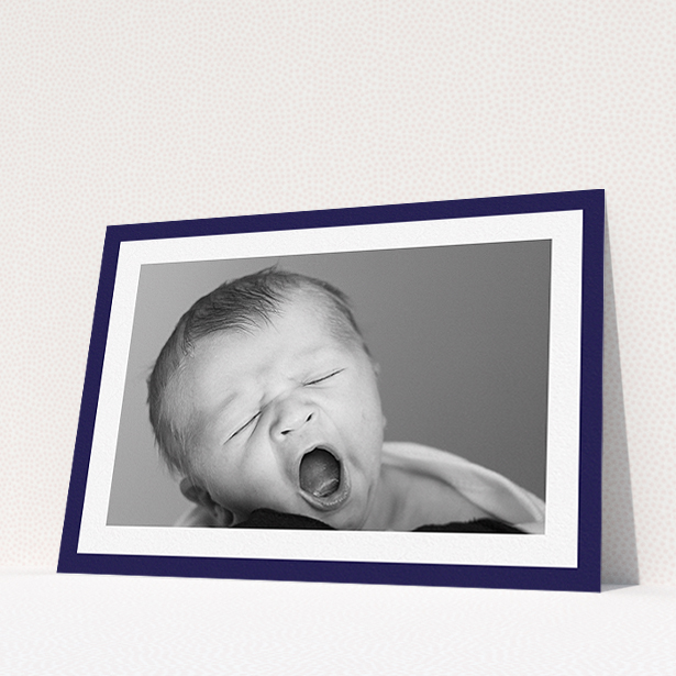 A christening invite called "Classic Navy Photo Frame". It is an A5 invite in a landscape orientation. It is a photographic christening invite with room for 1 photo. "Classic Navy Photo Frame" is available as a flat invite, with tones of blue and white.