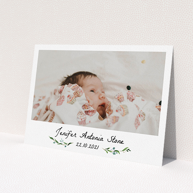 A christening invite design named 'Floral Fix'. It is an A5 invite in a landscape orientation. It is a photographic christening invite with room for 1 photo. 'Floral Fix' is available as a flat invite, with tones of black and white.