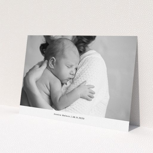 A christening invite design called 'Landscape Photo'. It is an A5 invite in a landscape orientation. It is a photographic christening invite with room for 1 photo. 'Landscape Photo' is available as a flat invite, with mainly white colouring.