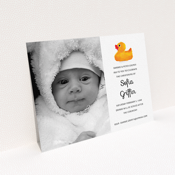 A christening invite design called "Rubber Ducky". It is an A6 invite in a landscape orientation. It is a photographic christening invite with room for 1 photo. "Rubber Ducky" is available as a flat invite, with tones of orange and white.