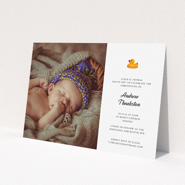 A christening invite design called 'Rubber Ducky Motif'. It is an A5 invite in a landscape orientation. It is a photographic christening invite with room for 1 photo. 'Rubber Ducky Motif' is available as a flat invite, with tones of white and orange.