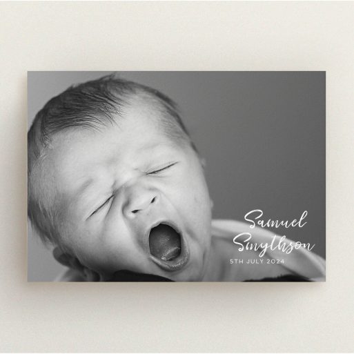 Christening Invite Design - "Soho Script" A christening invite design titled "Soho Script". It is an A5 invite in a landscape orientation. It is a photographic christening invite with room for 1 photo. "Soho Script" is available as a flat invite, with mainly white colouring.