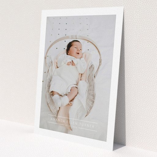 A christening invite design titled 'Tramlines'. It is an A5 invite in a portrait orientation. It is a photographic christening invite with room for 1 photo. 'Tramlines' is available as a flat invite, with mainly white colouring.