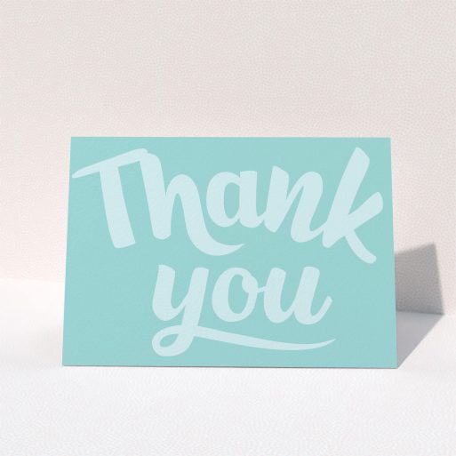 Christening Thank You Card Design - "Big Blue Typography" A christening thank you card named "Big Blue Typography". It is an A5 card in a landscape orientation. "Big Blue Typography" is available as a folded card, with mainly blue colouring.