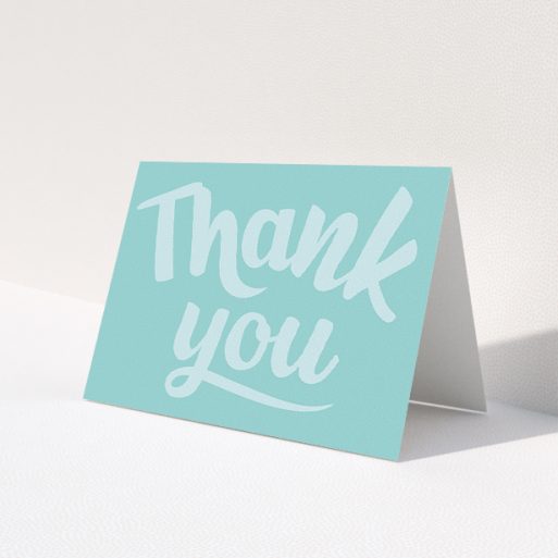 A christening thank you card named 'Big Blue Typography'. It is an A5 card in a landscape orientation. 'Big Blue Typography' is available as a folded card, with mainly blue colouring.