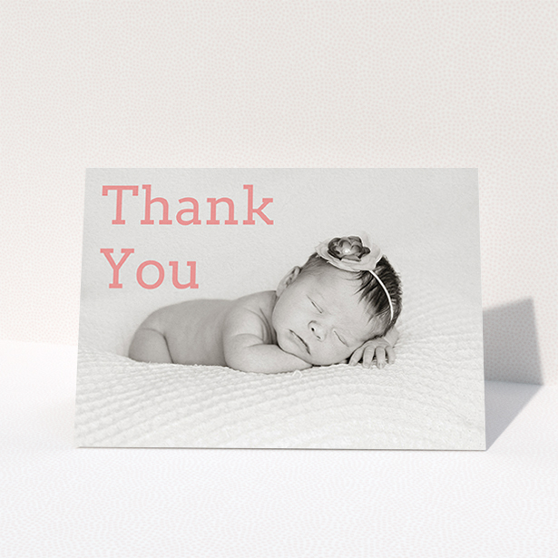 A christening thank you card design titled "Big Thanks". It is an A6 card in a landscape orientation. It is a photographic christening thank you card with room for 1 photo. "Big Thanks" is available as a folded card, with mainly light pink colouring.