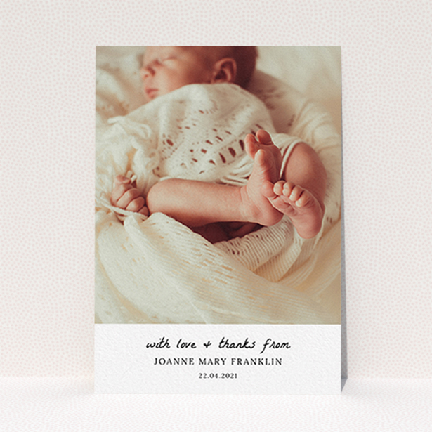 A christening thank you card design titled "Black and White Thanks". It is an A6 card in a portrait orientation. It is a photographic christening thank you card with room for 1 photo. "Black and White Thanks" is available as a flat card, with mainly white colouring.
