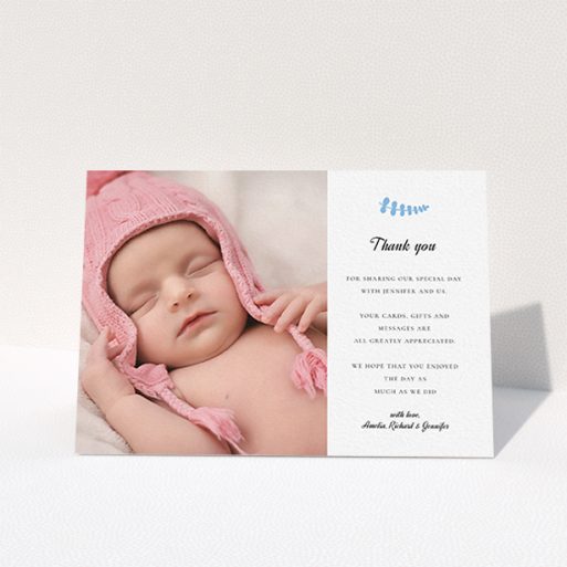 A christening thank you card design named "Blue Fern". It is an A6 card in a landscape orientation. It is a photographic christening thank you card with room for 1 photo. "Blue Fern" is available as a folded card, with tones of white and blue.