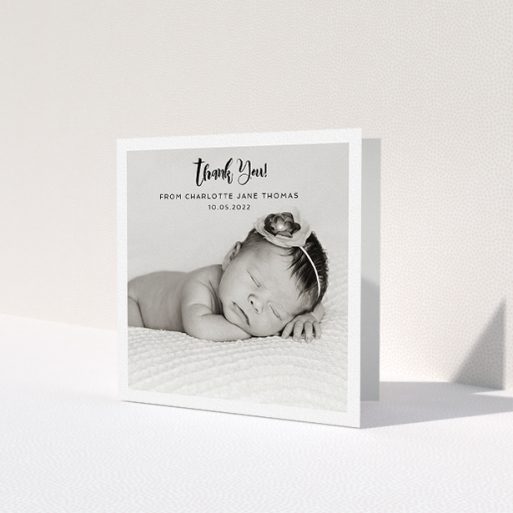 A christening thank you card design called 'Bordered Photo Square'. It is a square (148mm x 148mm) card in a square orientation. It is a photographic christening thank you card with room for 1 photo. 'Bordered Photo Square' is available as a folded card, with mainly white colouring.