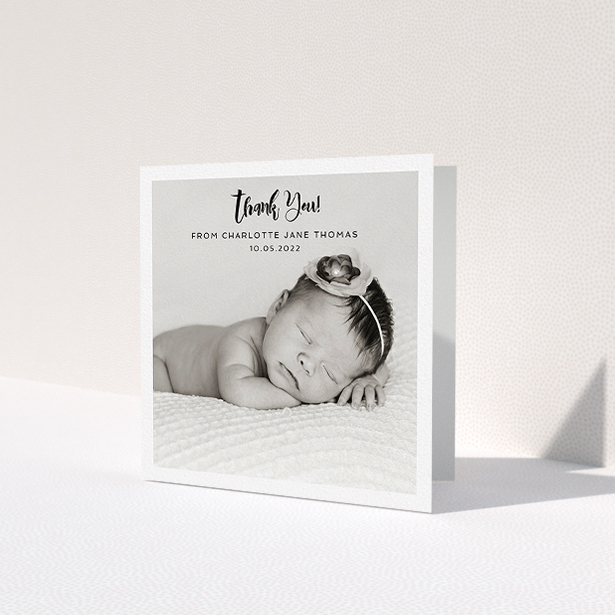 A christening thank you card design called 'Bordered Photo Square'. It is a square (148mm x 148mm) card in a square orientation. It is a photographic christening thank you card with room for 1 photo. 'Bordered Photo Square' is available as a folded card, with mainly white colouring.